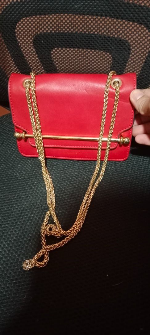 Strathberry Ruby Red East West Mini Crossbody Bag (Category: Luxury Bags & Wallets) located in Butuan. Submitted by fabchichub (Listing ID 1307265818, Image 2). Description: Get this AUTHENTIC 𝐒𝐭𝐫𝐚𝐭𝐡𝐛𝐞𝐫𝐫𝐲 𝐑𝐮𝐛𝐲 𝐑𝐞𝐝 𝐄𝐚𝐬𝐭 𝐖𝐞𝐬𝐭 𝐌𝐢𝐧𝐢 𝐂𝐫𝐨𝐬𝐬𝐛𝐨𝐝𝐲 𝐁𝐚𝐠. Made from smooth leather in Ruby red with beautiful goldtone hardware. The East/West is an effortlessly elegant go-to style for both day and evening wear, defined b