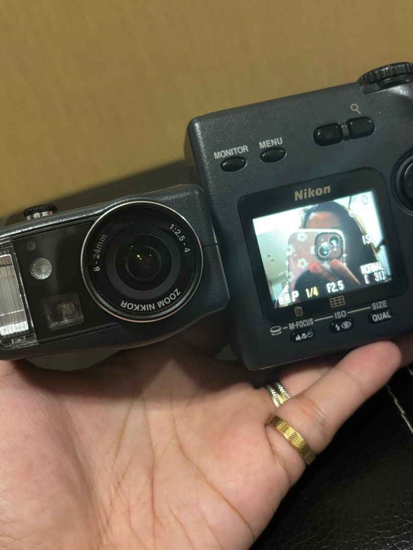 Nikon Coolpix 990 (Swiveling Camera) (Category: Cameras) located in Manila. Submitted by sweetcaramela (Listing ID 1307408903, Image 3). Description: PLEASE READ DESCRIPTION Nikon Coolpix 990 Rare Swivel Digital Camera - Working condition - Very good cosmetic condition(refer to pics) - Clean viewfinder and lens - Clear LCD - With CF card - 3.34 megapixels - Vintage output - CCD - 3xzoom - English menu - Uses 4 AA batteries(not included) Please se