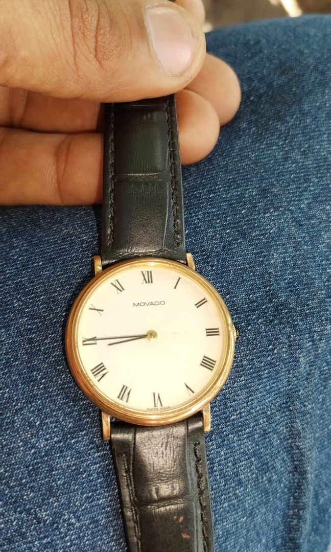 Movado 14 k solid gold watch