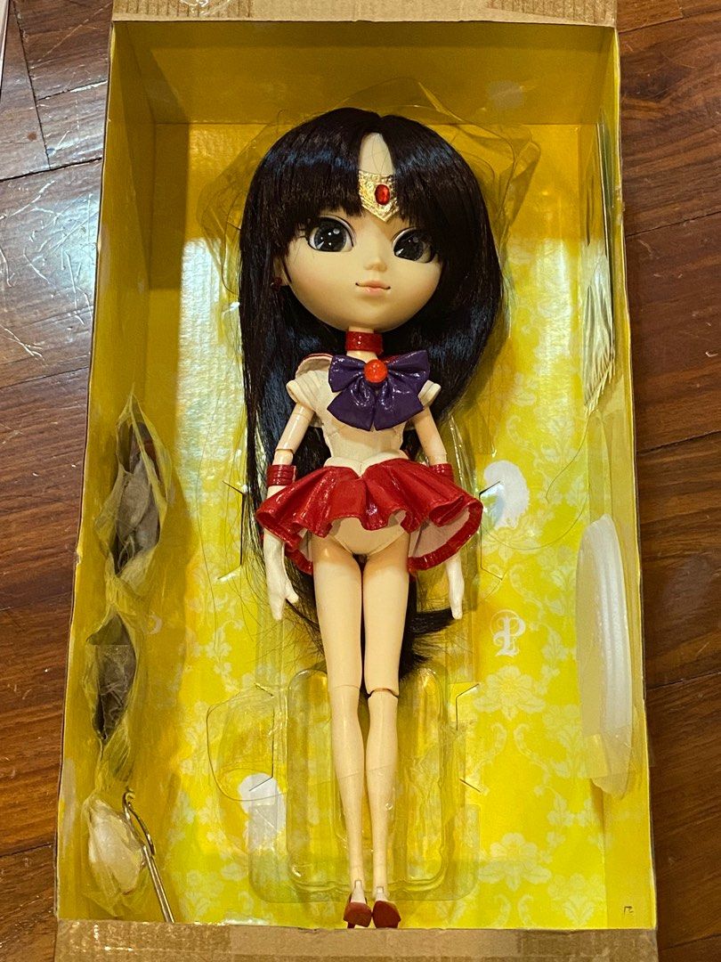 Pullip Sailor Mars Bandai Ver W/ Uniform (Category: Figurines & Statues) located in Davao. Submitted by chelleyyyyy (Listing ID 1307700045, Image 3). Description: Pullip Sailor Mars Bandai Version With Uniform The doll has been unboxed but never displayed With Box Her uniform (2nd outfit) is still sealed in the box along with her stand and card ‼️her sailor uniform has slight pink staining‼️.