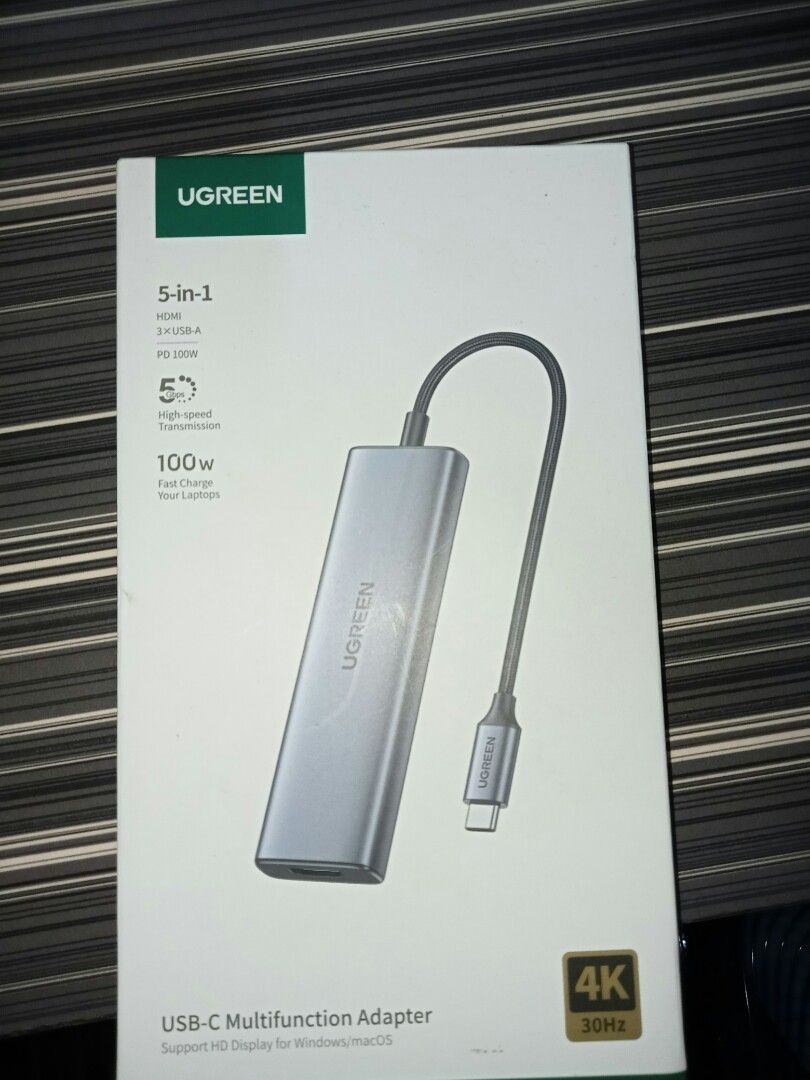Ugreen USB-C Adapter (Category: Cables & Adaptors) located in Marikina City. Submitted by rafer.shop (Listing ID 1307736826, Image 1). Description: Delivery will be paid by buyer Specifications: Type: HUB USB connector standard: 3.2nd gen 1 Plug: USB-C Ports: 3 x USB 3.2 gen. 1,1 x HDMI 2.0, 1 x SD card reader, 1 x TF card reader, 1 x USB Type C PD 100W Transfer speed: up to 5 Gbps Maximum resolution: 4K@30Hz Construction material: Aluminum Dimen