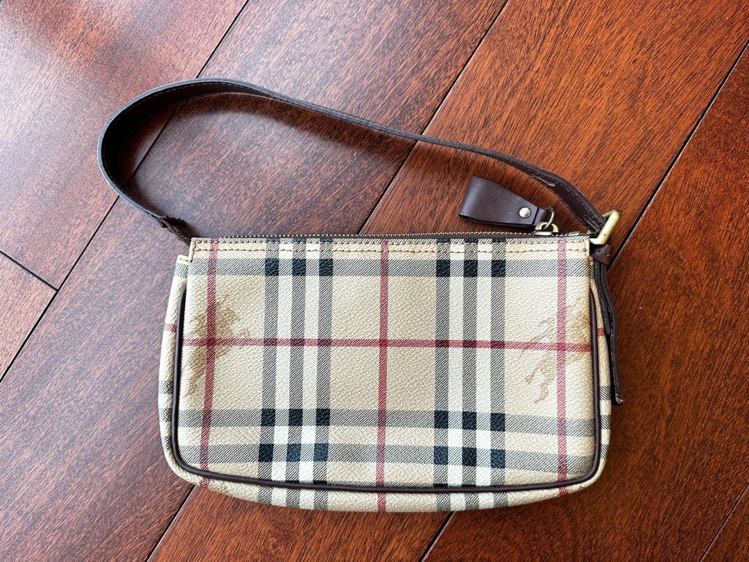 Burberry Nova Pochette (vintage, guaranteed authentic) (Category: Luxury Bags & Wallets) located in Makati City. Submitted by juju_08 (Listing ID 1307847701, Image 1). Description: Slightly used, still in excellent condition. Guaranteed authentic, comes with its original dust bag. .