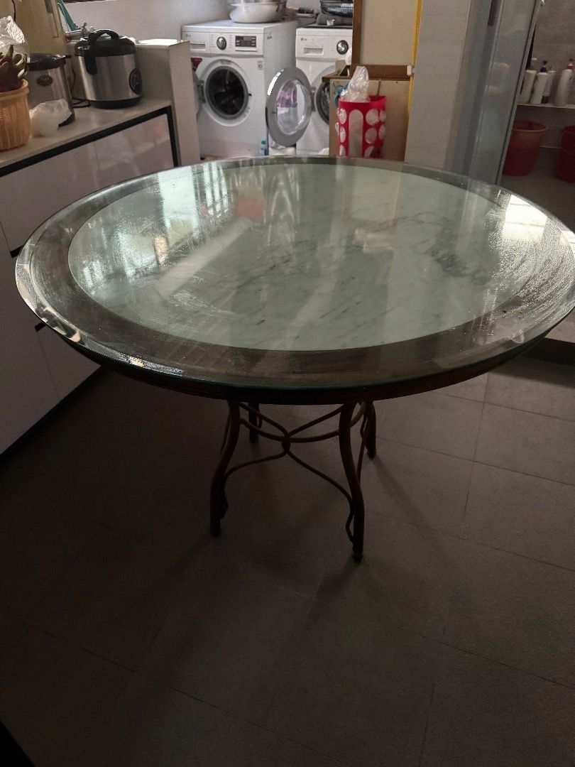 Dining Round Table (Category: Tables & Sets) located in Singapore. Submitted by jonyboyo (Listing ID 1307856142, Image 1). Description: Metal Leggings, Glass top. Willing to negotiate for quick deal Diameter 106cm Height 77cm Self-Collect only at Tampines Street 72, arrange your own delivery logistics. .