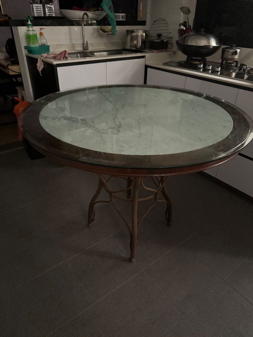 Dining Round Table (Category: Tables & Sets) located in Singapore. Submitted by jonyboyo (Listing ID 1307856142, Image 2). Description: Metal Leggings, Glass top. Willing to negotiate for quick deal Diameter 106cm Height 77cm Self-Collect only at Tampines Street 72, arrange your own delivery logistics. .