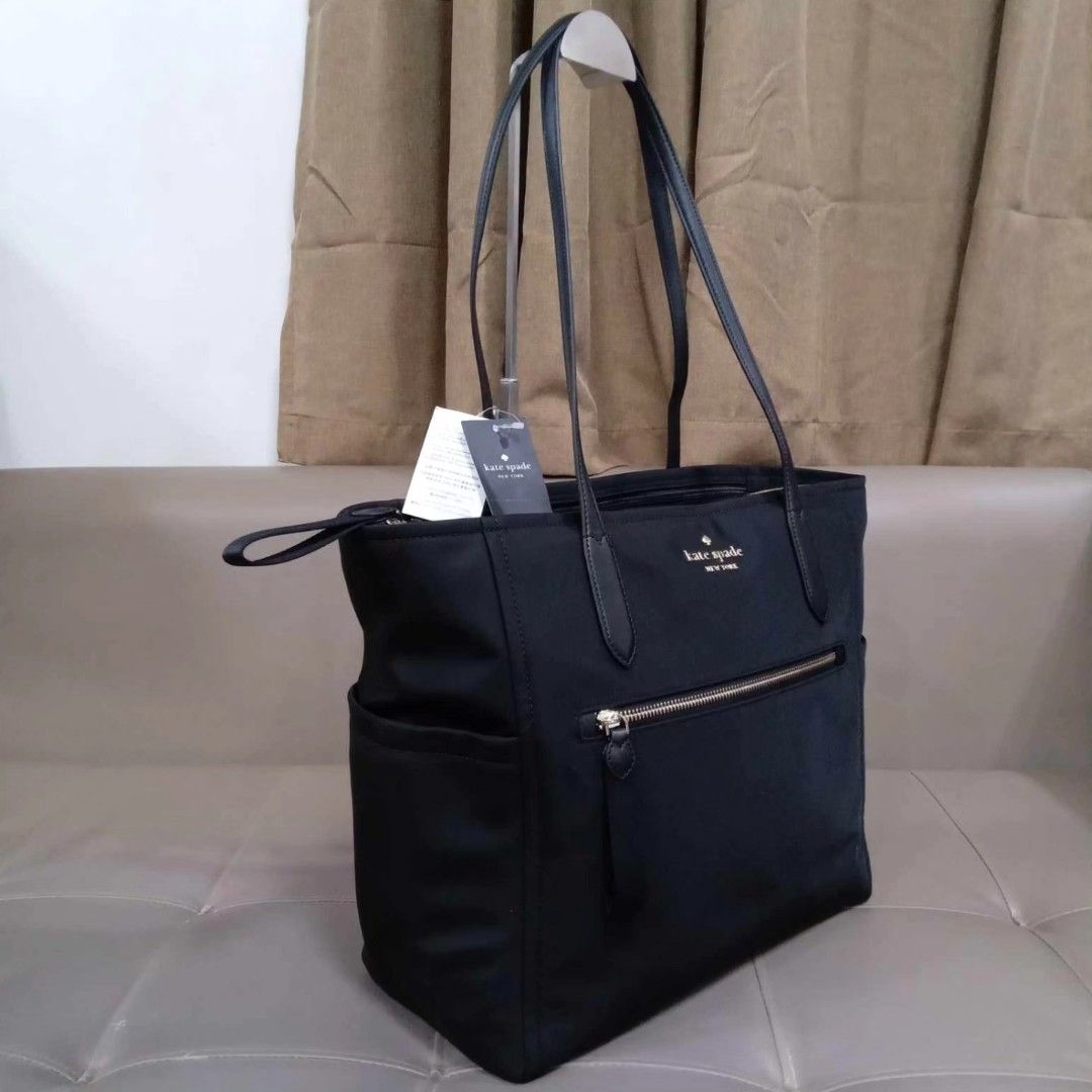 Kate Spade Black Large Zipper Tote (Category: Luxury Bags & Wallets) located in Taguig. Submitted by esa.agustin (Listing ID 1307818583, Image 2). Description: Original Kate Spade black nylon large zipper tote bag. Has 2 side compartments for water tumbler and 1 compartment inside for laptop. With tag. Bouhgt in US..