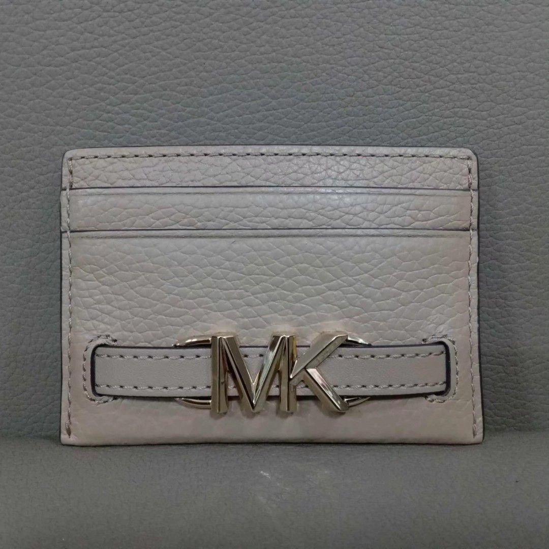 Micheal Kors Card Holder (Category: Luxury Bags & Wallets) located in Taguig. Submitted by esa.agustin (Listing ID 1307905259, Image 1). Description: Otiginal Micheal Kors leather card holder. Color is Camel and in gold hardware. With tag. Bought in US..