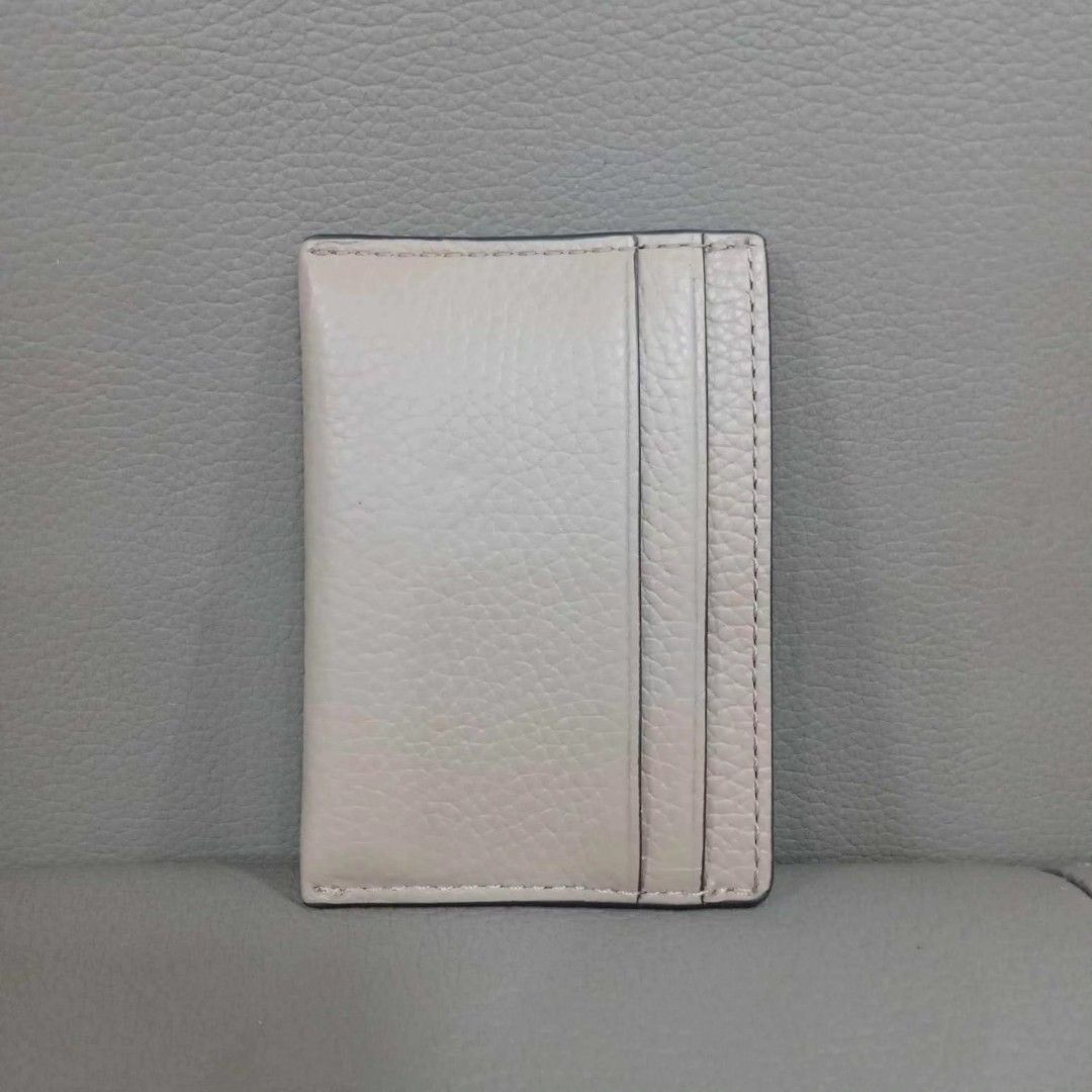 Micheal Kors Card Holder (Category: Luxury Bags & Wallets) located in Taguig. Submitted by esa.agustin (Listing ID 1307905259, Image 3). Description: Otiginal Micheal Kors leather card holder. Color is Camel and in gold hardware. With tag. Bought in US..