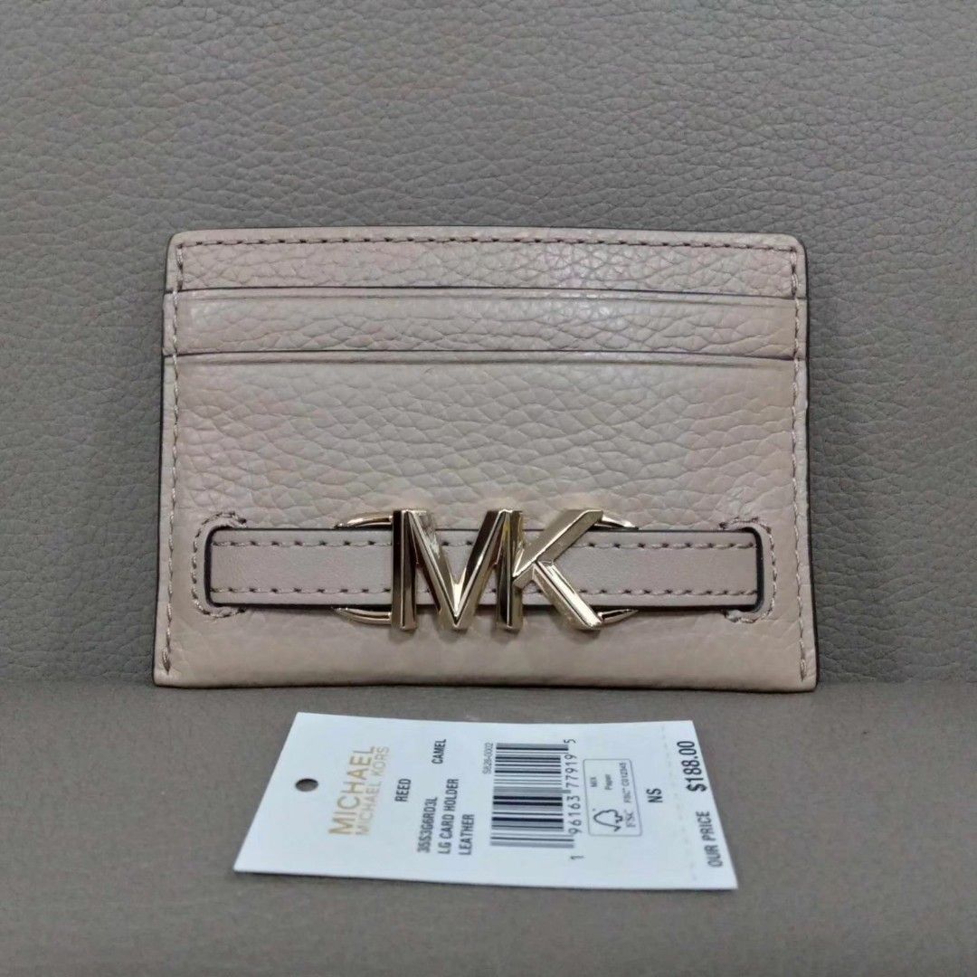 Micheal Kors Card Holder (Category: Luxury Bags & Wallets) located in Taguig. Submitted by esa.agustin (Listing ID 1307905259, Image 2). Description: Otiginal Micheal Kors leather card holder. Color is Camel and in gold hardware. With tag. Bought in US..