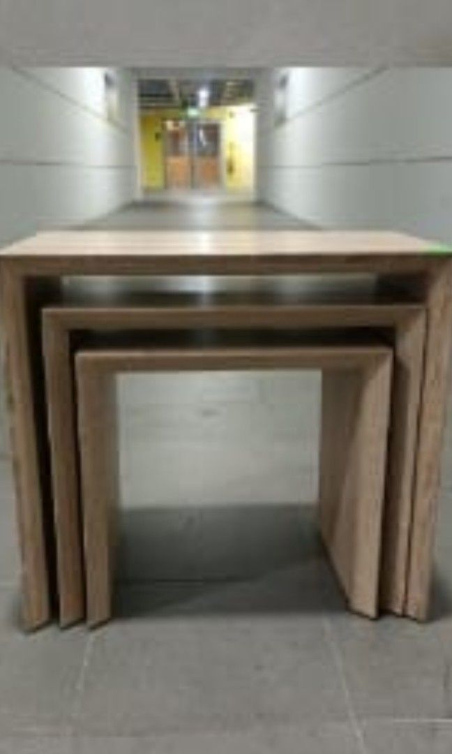 Nesting Table (Category: Other Home Furniture) located in Singapore. Submitted by rtherapy (Listing ID 1307889838, Image 1). Description: lightly used oak table. nice decoration and easy to keep. arrange own pick up and on weekdays night after 830pm or Sunday after 5pm due to busy schedule. biggest table length 43cm breath 30cm ( for all 3 tables ) height 39cm middle length 37cm breath 30cm height 36cm.