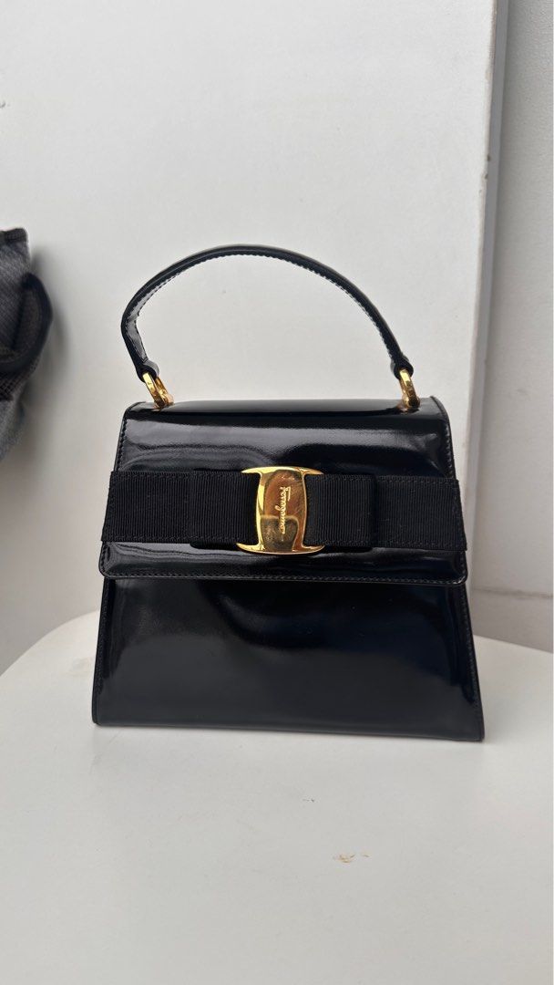 Salvatorre Ferragamo bow bag (Category: Luxury Bags & Wallets) located in Makati City. Submitted by boxfulgoodies (Listing ID 1307854410, Image 1). Description: Authentic Salvatorre Ferragamo Top handle crossbody bag Strap is removable if you want to just carry it via the handle Patent with gold hardware Promax can fit Generic white dustbag included One of my favorite bags for night out and wedding. So elegant and classy. Had to let go because i 