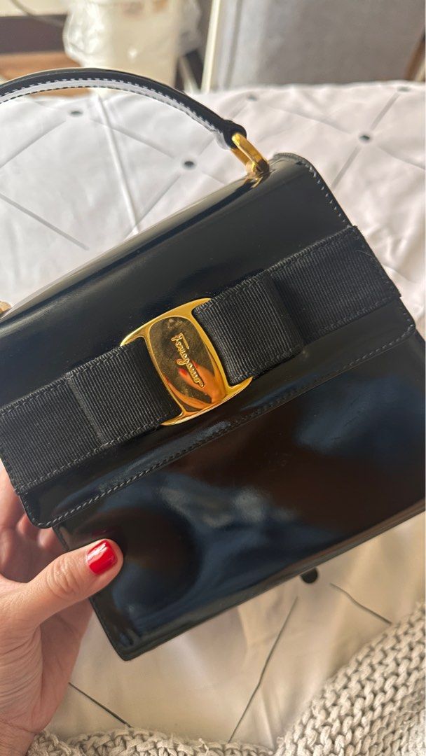 Salvatorre Ferragamo bow bag (Category: Luxury Bags & Wallets) located in Makati City. Submitted by boxfulgoodies (Listing ID 1307854410, Image 3). Description: Authentic Salvatorre Ferragamo Top handle crossbody bag Strap is removable if you want to just carry it via the handle Patent with gold hardware Promax can fit Generic white dustbag included One of my favorite bags for night out and wedding. So elegant and classy. Had to let go because i 
