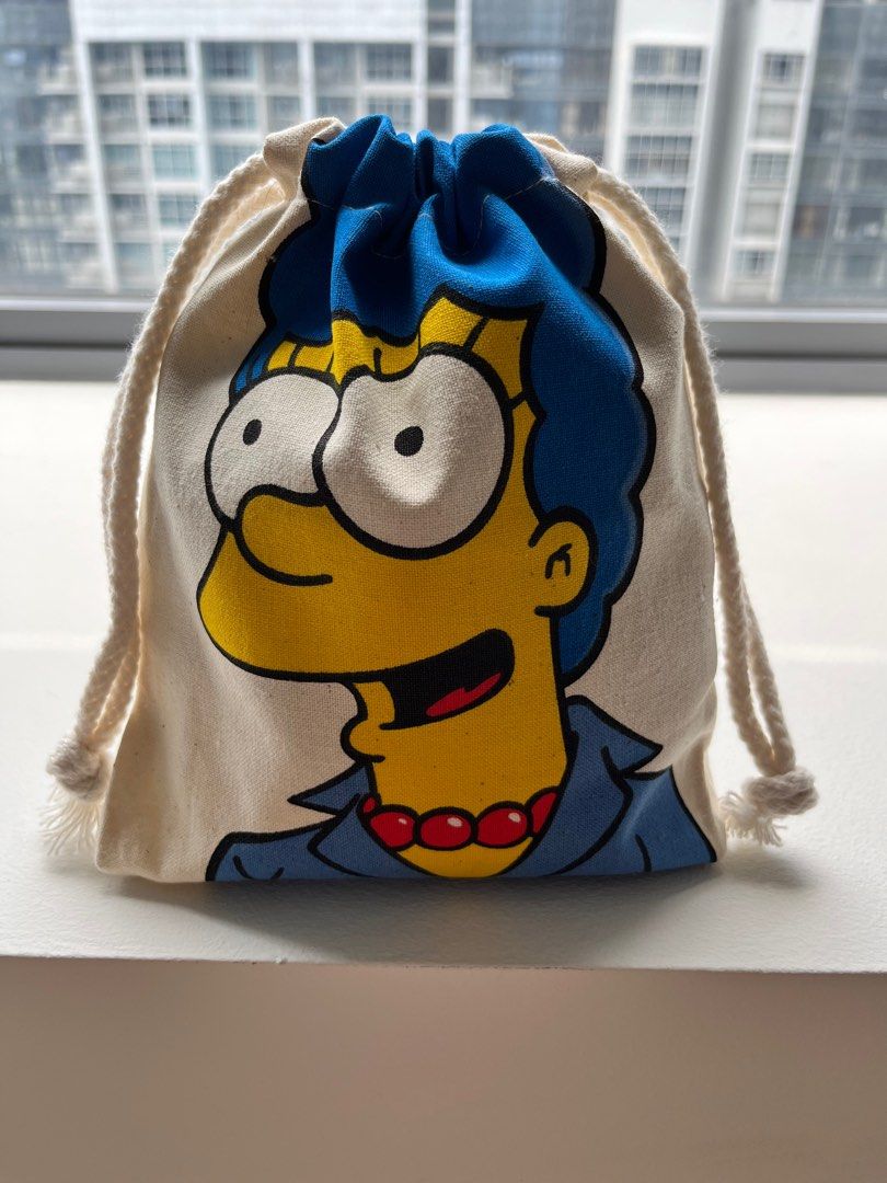Simpsons Drawstring Pouch (Category: Purses & Pouches) located in Singapore. Submitted by theflintstone (Listing ID 1307799407, Image 3). Description: Simpsons Drawstring Pouch Approx. 17cm across x 21cm height Price: $9 each $16 for 2 Available in Marge Simpsons and Bart Simpsons design. Good for make up products and small accessories! Cute and functionable. Get yours today :) .