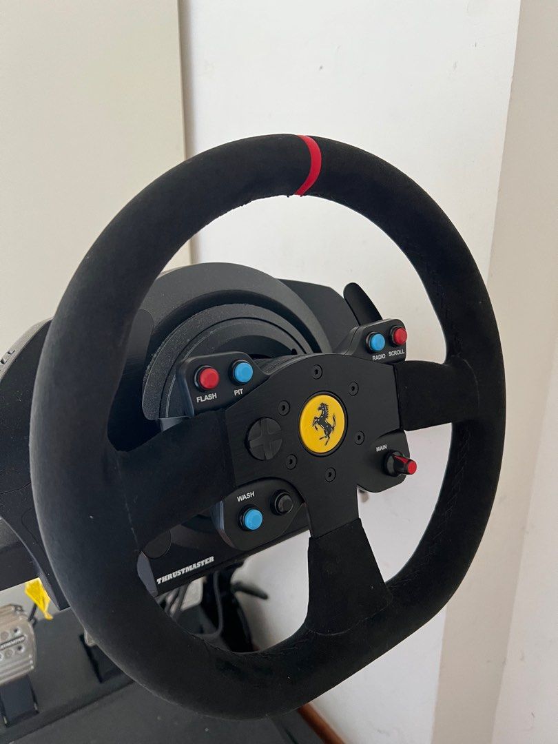 Thrustmaster T300 (Category: Controllers) located in Singapore. Submitted by streetsale220 (Listing ID 1307899596, Image 1). Description: FAST DEAL/URGENT TO CLEAR PLEASE TAKE THEM COMES WITH THE ORIGINAL BOX FOR THE WHEELS AND WHEEL STAND Compatible with PS4, PS5 and PC only Ferrari Branded Thrustmaster Racing Wheel with wheel stand included in the bundle Like new with box (used less than 3 times and that’s it, severely underused) What you is wh