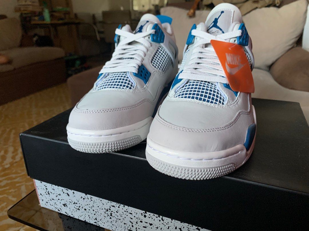 air Jordan 4 RETRO (Category: Sneakers) located in Marikina City. Submitted by chestmaester708 (Listing ID 1311873904, Image 2). Description: For sale: Brand new Air Jordan 4 Retro in the “White/Varsity Blue” colorway. These iconic sneakers feature a clean white leather upper with striking varsity blue accents and a speckled midsole. Size 10 US (men’s) with a Euro size of 44, these shoes come with the original box. Perfect for both collectors and