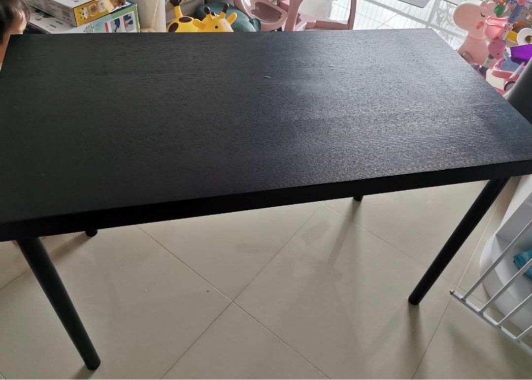 Ikea Study Table (Category: Tables & Sets) located in Singapore. Submitted by mashpotatoez (Listing ID 1311853081, Image 1). Description: Ikea study table 120cm*60cm*75. 5cm(height) Have dismantled, able to fit in taxi back seat. Table top is not the usual thin one as 3.4cm, this one is solid with 5cm thickness. Wood grain surface, can use as a small dining table. Self collect at Changi.