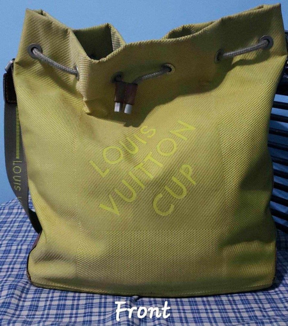 Louis Vuitton Limited Edition - Pre LOVED (Category: Luxury Bags & Wallets) located in Manila. Submitted by thepreciousgift (Listing ID 1311767420, Image 2). Description: Louis Vuitton Limited edition Lime Green 2003 LV Cup made in France size : 14.2*5.1x15.9 inches shoulder drop : 17.3inches adjustable material : canvass color: green no box no dust bag inside : very clean with light signs of use ( see picture).