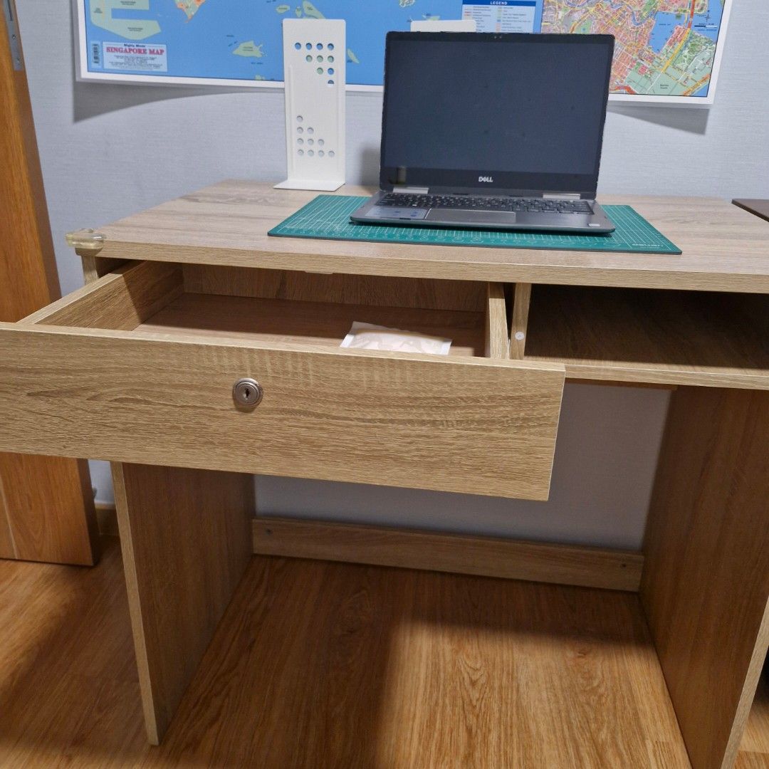Study Table (Category: Tables & Sets) located in Singapore. Submitted by j_ellure_j (Listing ID 1311847026, Image 2). Description: sturdy yet minimalist study desk. lost the key, so drawer unable to lock. self collect at Anchorvale Sengkang..