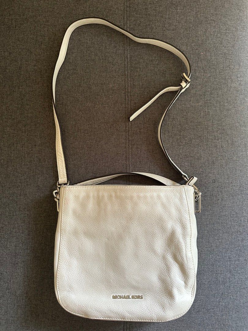 Authentic Michael Kors Cross Body Bag (White) (Category: Luxury Bags & Wallets) located in Muntinlupa City. Submitted by shopnb (Listing ID 1313447174, Image 1). Description: Original Price: P15,000 Selling for: P1200 Condition: Well used, bag needs cleaning.