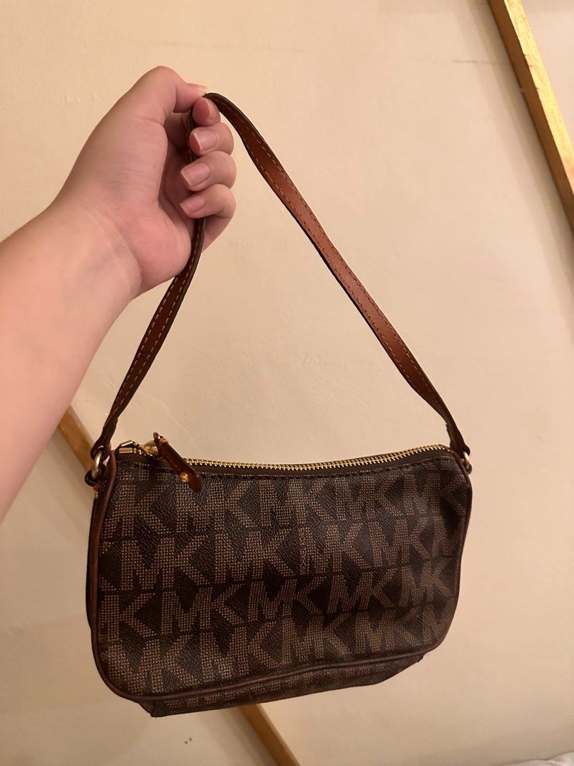authentic michael kors kili kili bag (Category: Luxury Bags & Wallets) located in Manila. Submitted by declutteringrandomstuff101 (Listing ID 1313530224, Image 2). Description: authentic mk kili kili bag slightly hard to open because of the zipper fade at the bottom but not that obvious when worn.