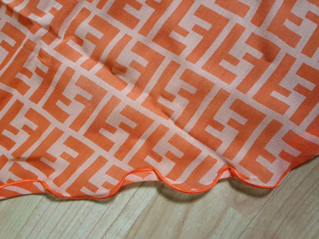 Fendi Logo Scarf (Category: Luxury Accessories) located in Manila. Submitted by mybrandshop (Listing ID 1313555531, Image 3). Description: Fendi Logo Orange Silk Scarf Authentic bought in Japan 41 cm x 100 cm.