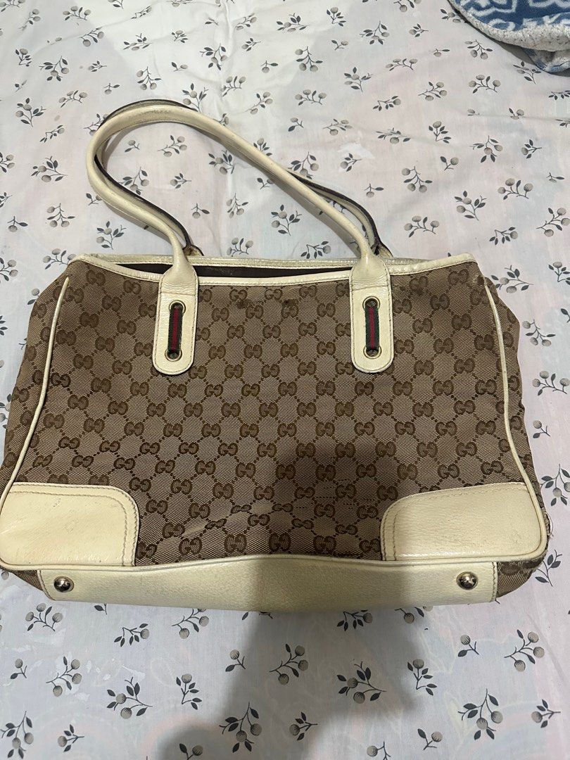 Gucci GG Sherry Line Shoulder Bag (Category: Luxury Bags & Wallets) located in Los Banos. Submitted by jeremiah31.3 (Listing ID 1313504447, Image 2). Description: Selling my well loved gucci shoulder bag. Has flaws as shown in the pics hence selling low. Can be your project bag but you can also use it as is. Straps are still in very good condition and the bag is very roomy..