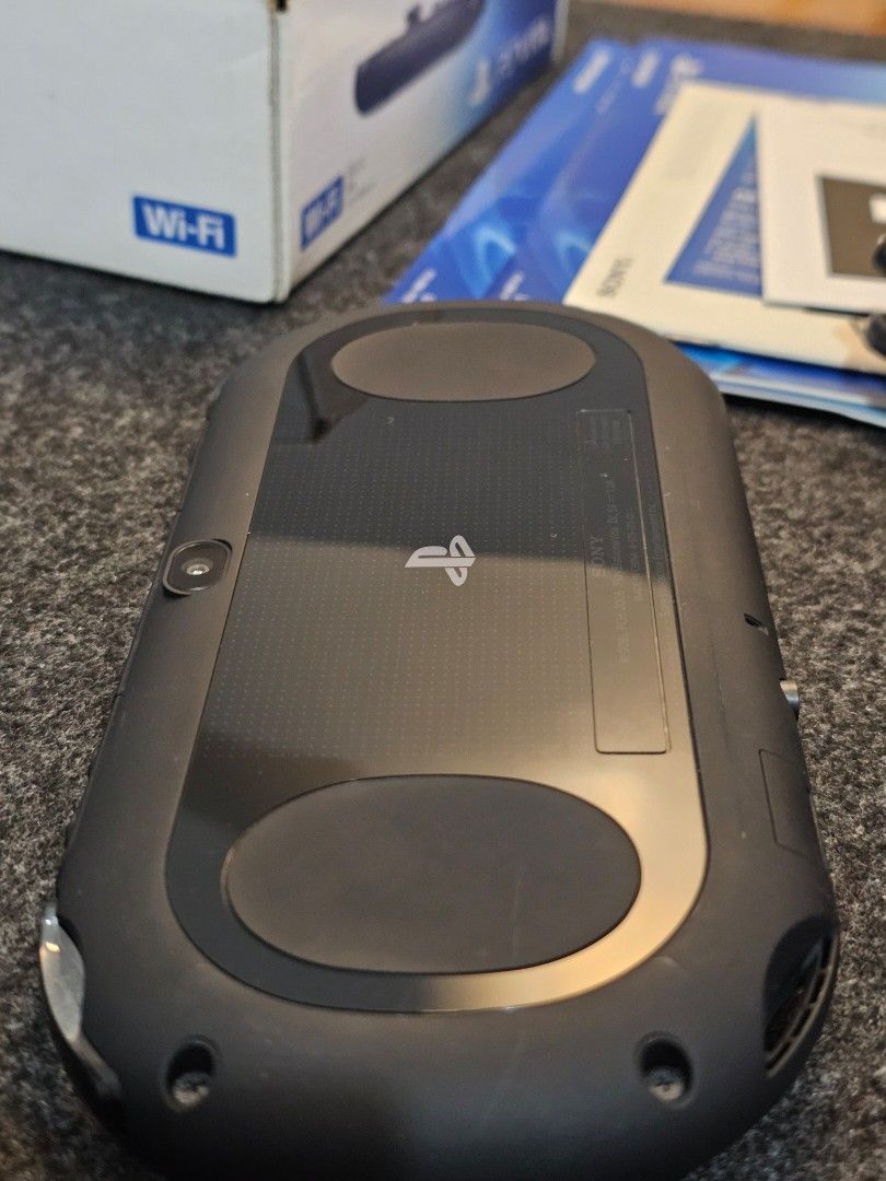 PS Vita Slim (Category: PlayStation) located in Paranaque City. Submitted by john020497 (Listing ID 1313552141, Image 3). Description: - Very good condition, smooth unit with just minimal hairline scratches at the back. - With box, ar cards, manuals and original charger. - With bag and case. Parañaque area. Delivery via Lalamove/Grab..