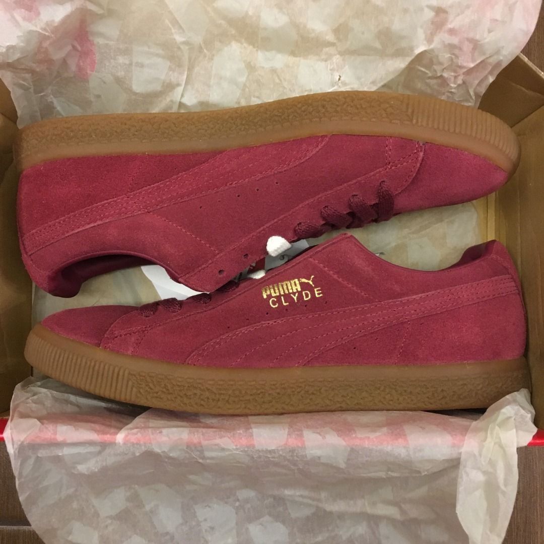 Burgundy pumas in the washing machine shop