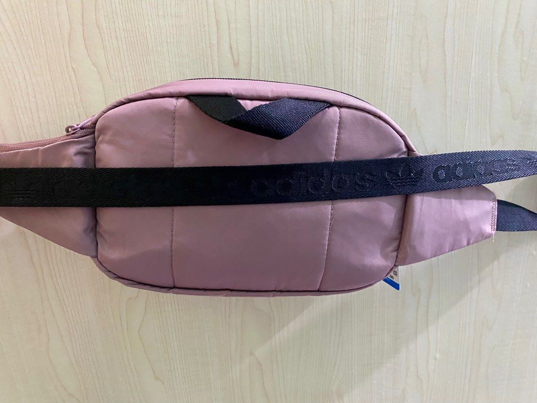 Adidas Belt Bag — Unisex (Category: Belt bags, Clutches and Pouches) located in Lipa City. Submitted by _flor_ (Listing ID 1313663310, Image 3). Description: Adidas Belt Bag - Unisex ‼️ONHAND‼️Guaranteed 💯 Authentic Approx. size: 10” (L) x 6.5” (H) x 3.5” (W) Features: * Top zip closure * Adjustable waist strap * External zip pocket * Polyester in construction * With tag, no paper bag * Color- Old rose Php 1,350 plus sf Courier: LBC Location: Li