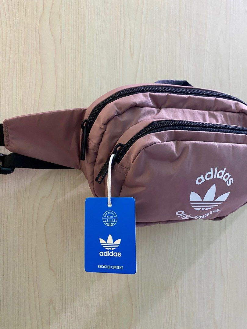 Adidas Belt Bag — Unisex (Category: Belt bags, Clutches and Pouches) located in Lipa City. Submitted by _flor_ (Listing ID 1313663310, Image 2). Description: Adidas Belt Bag - Unisex ‼️ONHAND‼️Guaranteed 💯 Authentic Approx. size: 10” (L) x 6.5” (H) x 3.5” (W) Features: * Top zip closure * Adjustable waist strap * External zip pocket * Polyester in construction * With tag, no paper bag * Color- Old rose Php 1,350 plus sf Courier: LBC Location: Li