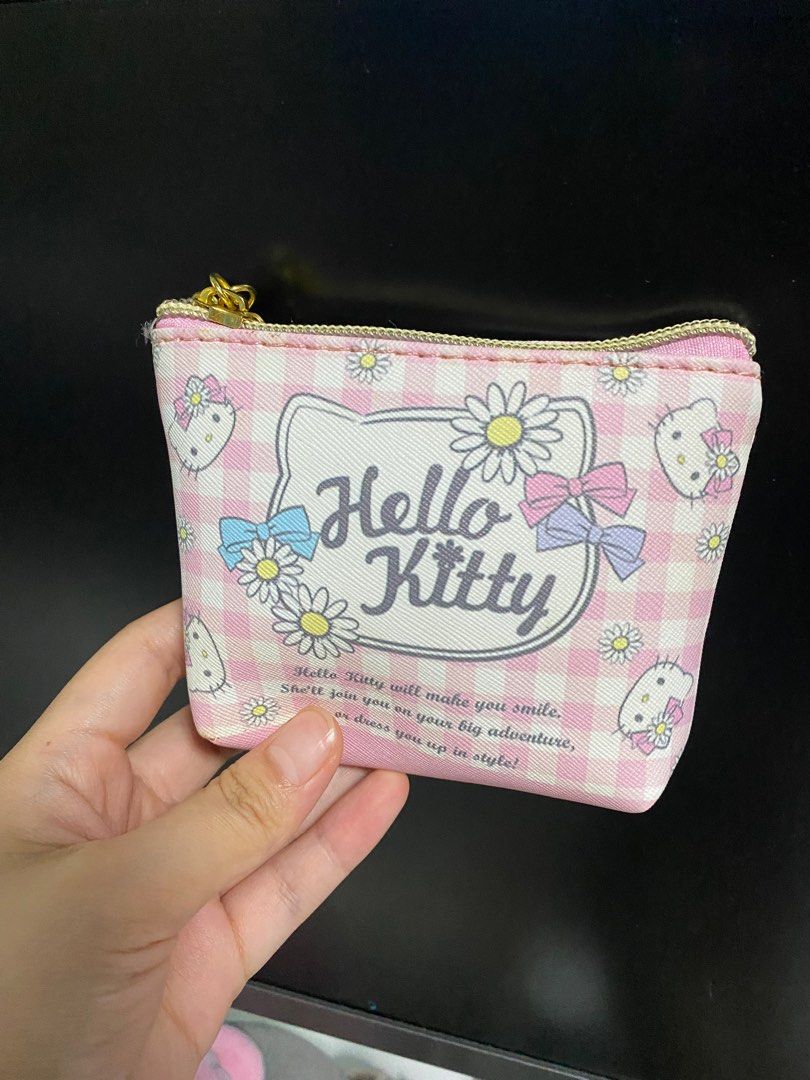 Hello Kitty Mini Pouch (Category: Purses & Pouches) located in Singapore. Submitted by awcutecorgi (Listing ID 1313644821, Image 1). Description: As good as new! Have never used it, and kept it in my cupboard. For hello kitty lovers :-).