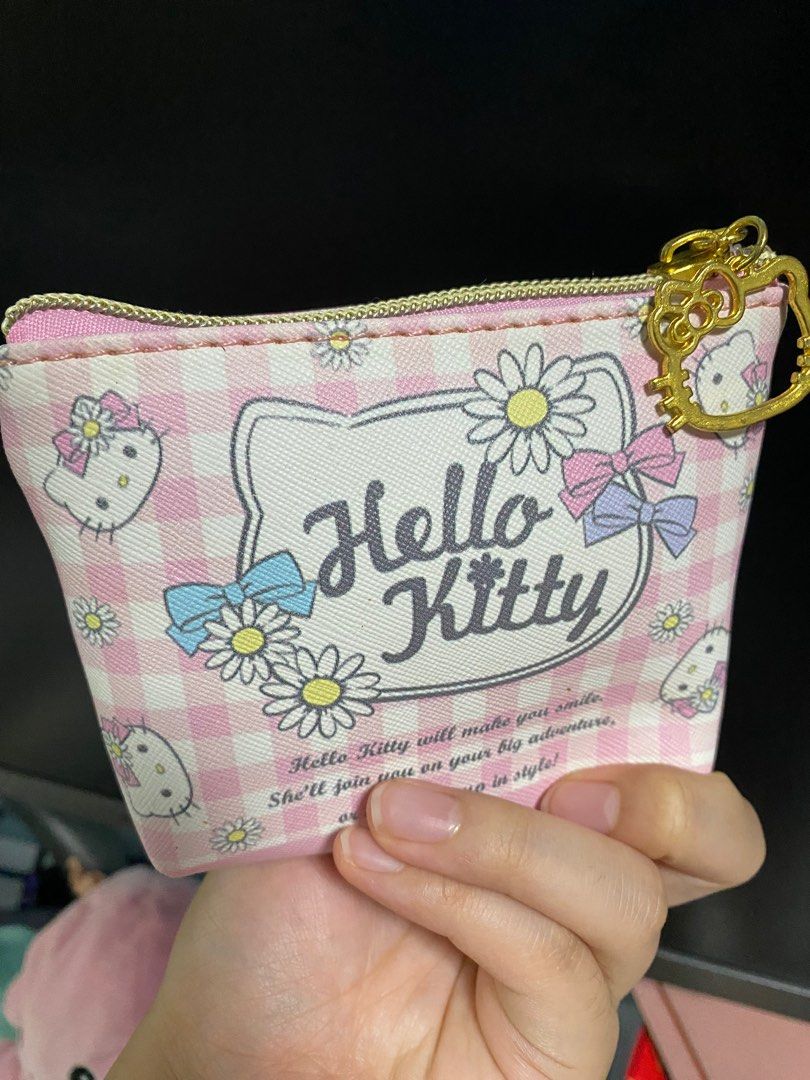 Hello Kitty Mini Pouch (Category: Purses & Pouches) located in Singapore. Submitted by awcutecorgi (Listing ID 1313644821, Image 2). Description: As good as new! Have never used it, and kept it in my cupboard. For hello kitty lovers :-).