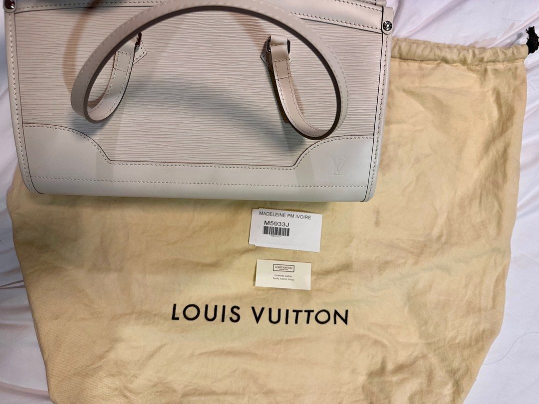 Louis Vuitton Madeleine PM Ivory (Category: Luxury Bags & Wallets) located in Quezon City. Submitted by missmari (Listing ID 1313735159, Image 2). Description: This classy Louis Vuitton Madeleine PM Ivory tote is finely crafted of LV’s signature textured epi leather in white. The tote features smooth white leather trim and double top handles, with polished silver hardware. The top zipper opens to an ivory fabric interior with a patch pocket. This