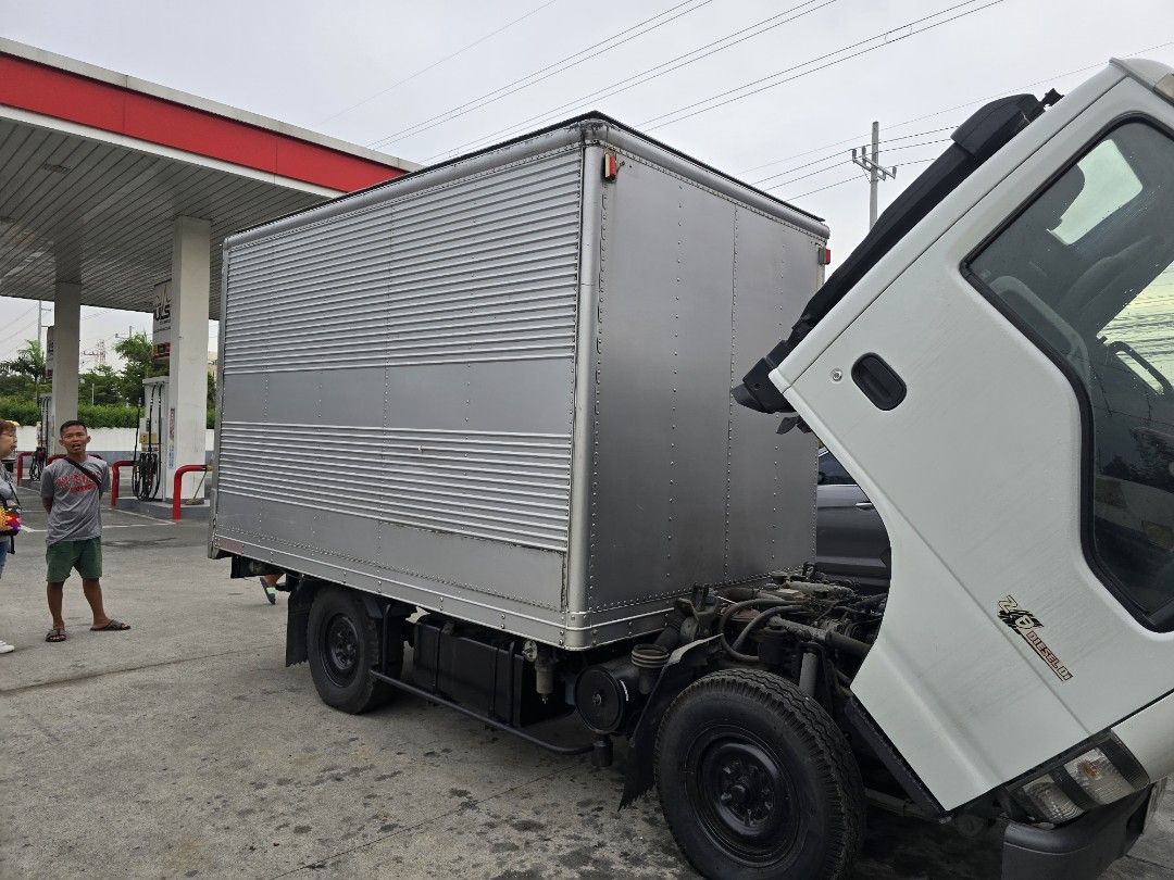 Isuzu Elf NHR Closevan 10ft (Category: Heavy Vehicles) located in Antipolo. Submitted by antipolo_autozone (Listing ID 1313902035, Image 3). Description: For sale or open For swap & Financing. Isuzu Elf 4Hf1. Close van. Manual Transmission Diesel. Single Tires 10ft. All new tires . 4HF1 Engine. Very good condition in or Out. Call Fast Transaction Antipolo city Area 09157233358.09424893311..