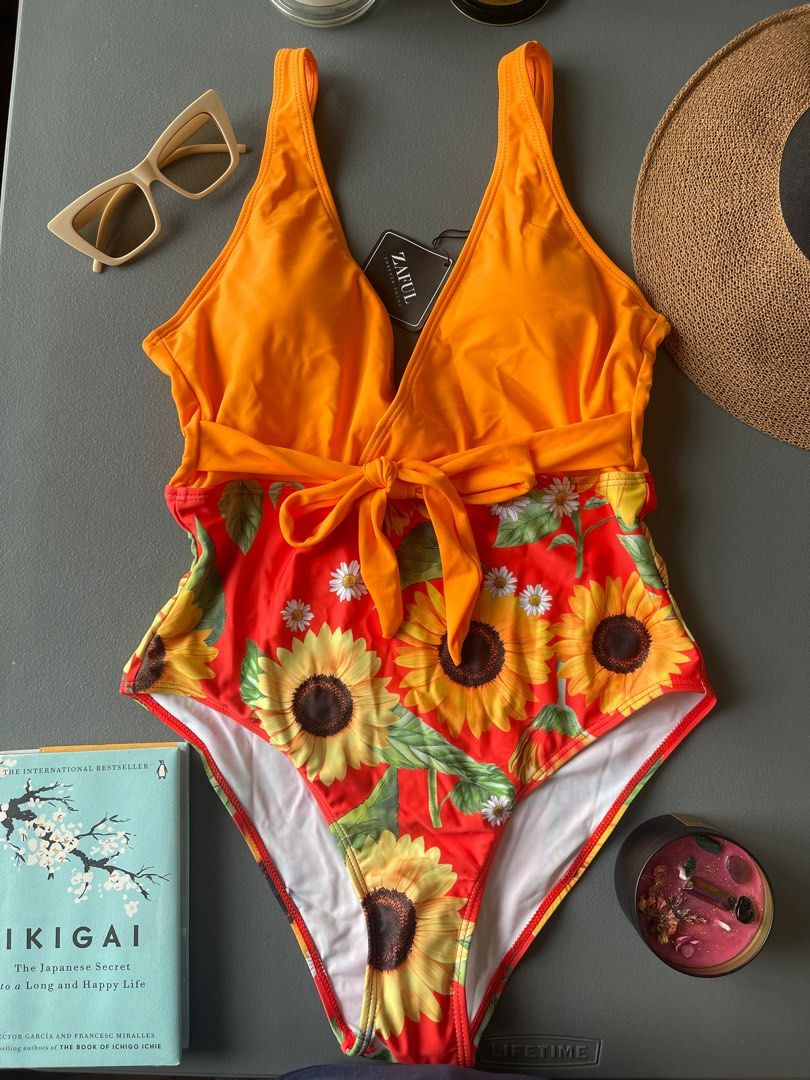 Red and Orange sunflower bikini one piece (Category: Bikinis & Swimsuits) located in Manila. Submitted by avery._ (Listing ID 1313889660, Image 1). Description: Zaful Brand Size Medium Rfs wrong size.