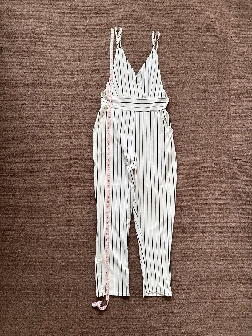 White Pinstripes Jumpsuit (Category: Jumpsuits) located in Quezon City. Submitted by declutteringbybones (Listing ID 1313799669, Image 3). Description: Unbranded white pinstripe jumpsuit Visible side boob, backless Size: XS RFS: decluttering, not my style, used once.