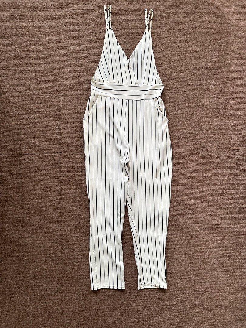 White Pinstripes Jumpsuit (Category: Jumpsuits) located in Quezon City. Submitted by declutteringbybones (Listing ID 1313799669, Image 1). Description: Unbranded white pinstripe jumpsuit Visible side boob, backless Size: XS RFS: decluttering, not my style, used once.