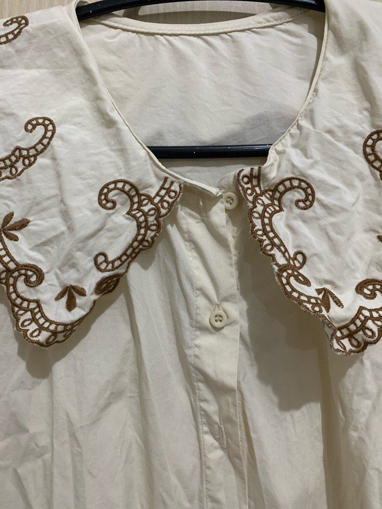 Babydoll Blouse with detailed collar (Category: Blouses) located in Quezon City. Submitted by caspii (Listing ID 1314073639, Image 3). Description: Babydoll blouse with detailed collar The main color is beige with brown lace-ish details I love the collar style!! Fits M-L, can also fit S but oversized MOP: Gcash/Maya Loc: Welcome Rotonda, QC.