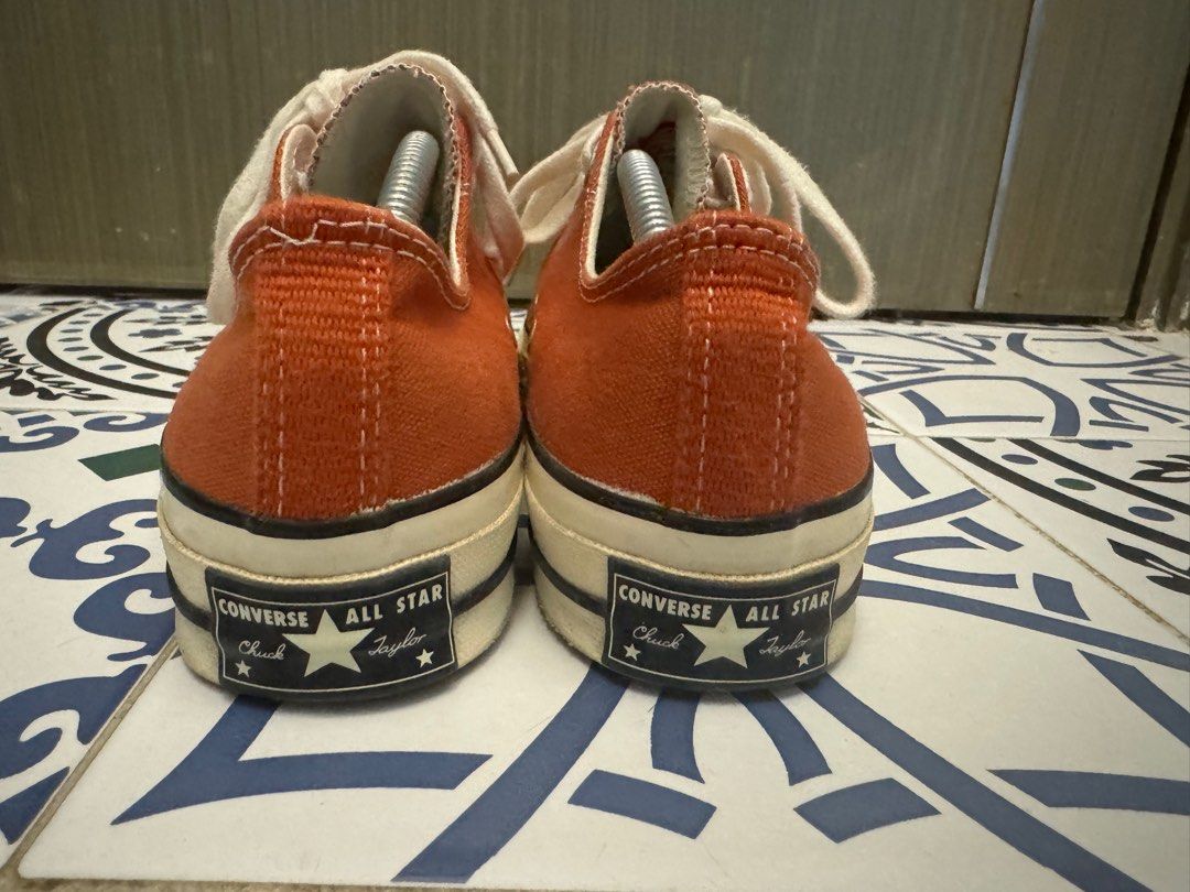 Orange chuck taylors store