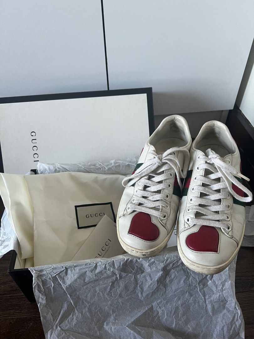 GUCCI ACE SNEAKERS HEART AUTHENTIC (Category: Sneakers & Footwear) located in Manila. Submitted by tk.preloved (Listing ID 1314086737, Image 1). Description: Gucci ace sneakers with red heart ❤️ AUTHENTIC 💯 Bought this in HK Size 35 (runs big) fit up to size 7 (im size 7) With dustbag, card and box No sira or anything. Just dirt Need cleaning nalang. But all good 🥰 Pm for sure buyer!!! Rfs: dna ngagamit .