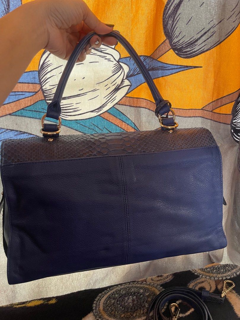 JEAN LOUIS SCHERRER BAG (Category: Luxury Bags & Wallets) located in Rizal. Submitted by preloved1143 (Listing ID 1314005708, Image 2). Description: JLS Phyton Bag Royal Blue Authentic Snake Leather No flaws Like New Can be worn in multiple ways Comes with shoulder, sling leather strap.
