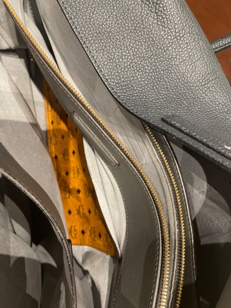 MCM Milla bag (Category: Luxury Bags & Wallets) located in Davao. Submitted by mliza1020 (Listing ID 1314097651, Image 3). Description: MCM Milla handy bag. 5 compartments. Grey. No sling. Preloved bag without flaws. Dimension: H 29 x L 41 x W 16 cm (approx) Made in Korea.