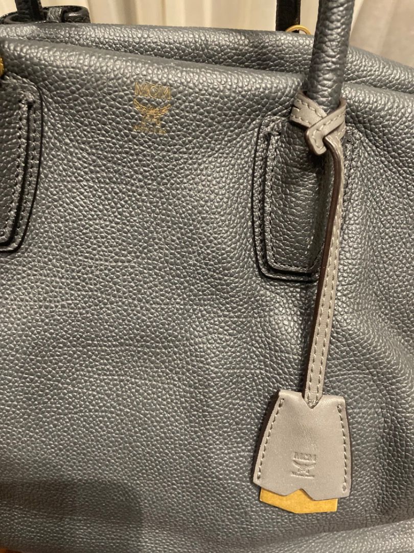 MCM Milla bag (Category: Luxury Bags & Wallets) located in Davao. Submitted by mliza1020 (Listing ID 1314097651, Image 2). Description: MCM Milla handy bag. 5 compartments. Grey. No sling. Preloved bag without flaws. Dimension: H 29 x L 41 x W 16 cm (approx) Made in Korea.