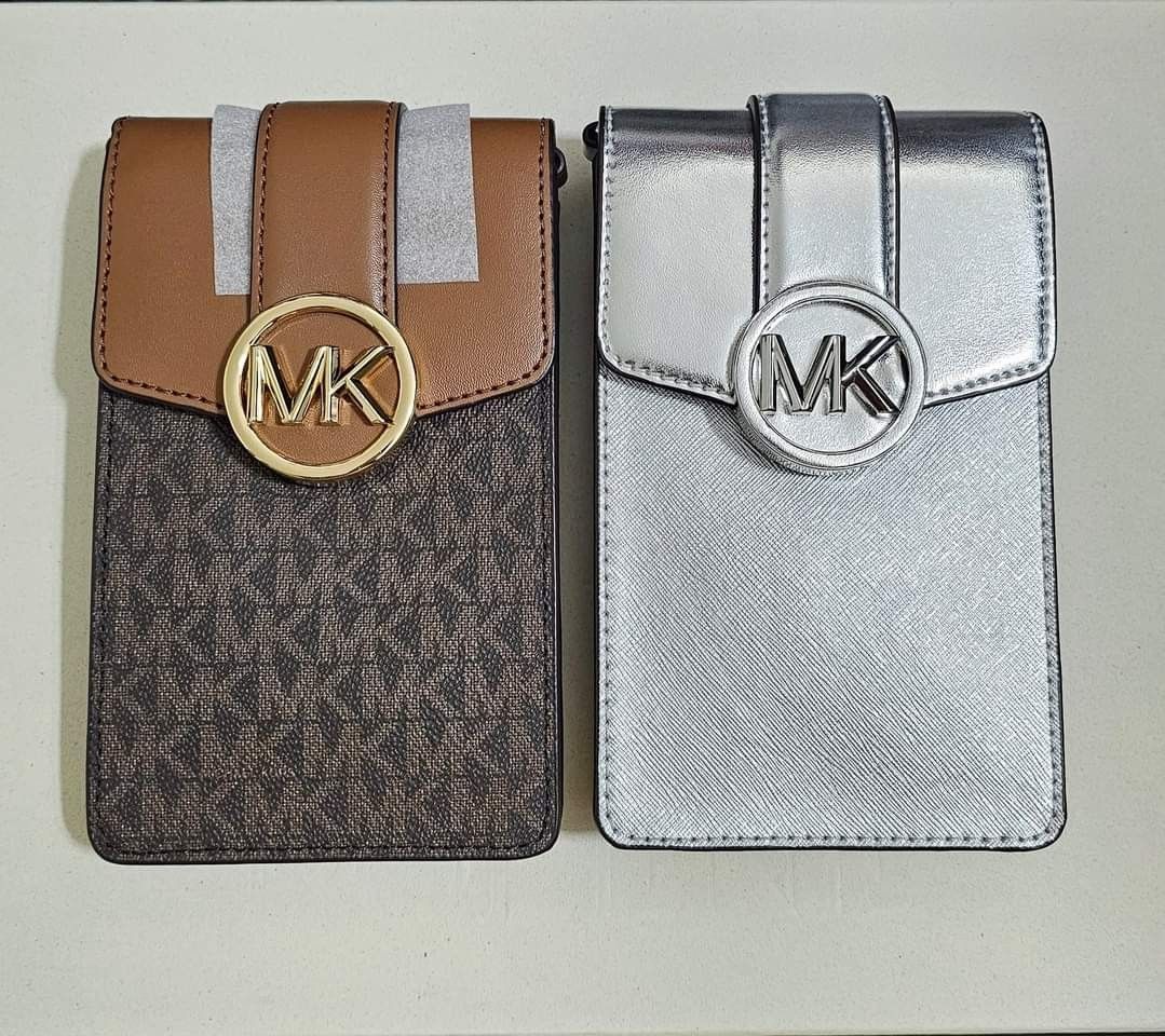 Michael Kors Carmen Phone Sling (Category: Purses & Pouches) located in Cainta. Submitted by annavm (Listing ID 1313979387, Image 1). Description: brand new michael kors Phone Sling original from US 2 mono brown 2 silver.
