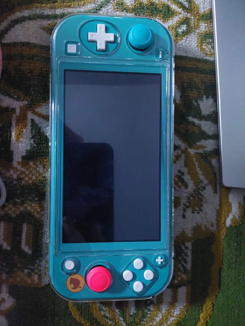 Nintendo switch lite (Category: Nintendo) located in Quezon City. Submitted by mranin2826 (Listing ID 1314075974, Image 2). Description: with warranty with physical game (animal crossing) with box with tempered glass with case with charger RFS- no longer using..