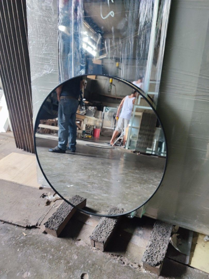 Round mirror with matte black aluminum frame (Category: Mirrors) located in Malabon City. Submitted by mirrors.ph (Listing ID 1313978492, Image 3). Description: Round mirror with matte black aluminum frame and plywood backing using 6mm thick copper free mirror. Size: 70cm diameter P1687.50 Add P100 if with back hook. Available colors gold, black, matte black, white and silver aluminum frame. Customize sizes and shapes are welcome..
