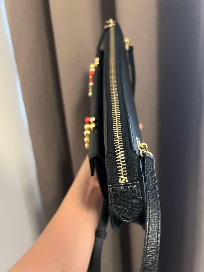 Monster FENDI Sling (Category: Luxury Bags & Wallets) located in Quezon City. Submitted by hellopatchi (Listing ID 1314314649, Image 3). Description: Fendi Monster Sling Rank A w/ inclusion.