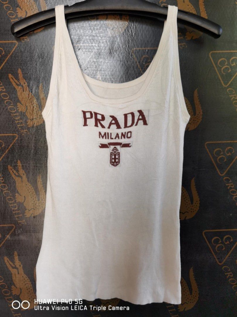 Prada knitted tanktop (Category: Luxury Apparel) located in Agoo. Submitted by omaethrift (Listing ID 1314192995, Image 1). Description: Issue Cut neck tag Needwash Fit small to medium Pag large pwede pa stretchy naman po.