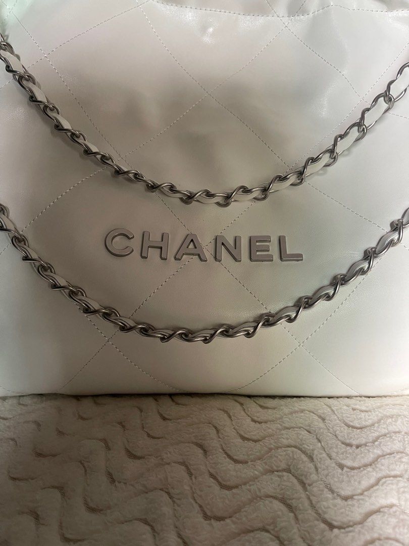 Chanel 22 (Category: Luxury Bags & Wallets) located in Silang. Submitted by girlyouneedthis (Listing ID 1314420976, Image 2). Description: Chanel 22 tote bag shoulder bag, real leather, chanel underzip, micro chip, with pouch, and dustbag. Can fit 12.9 inch Ipad and many more, super minimalist and versatile bag. With minimal flaw that’s why Selling for super low. Last photo is the flaw. No returns, No exchange, No refunds..