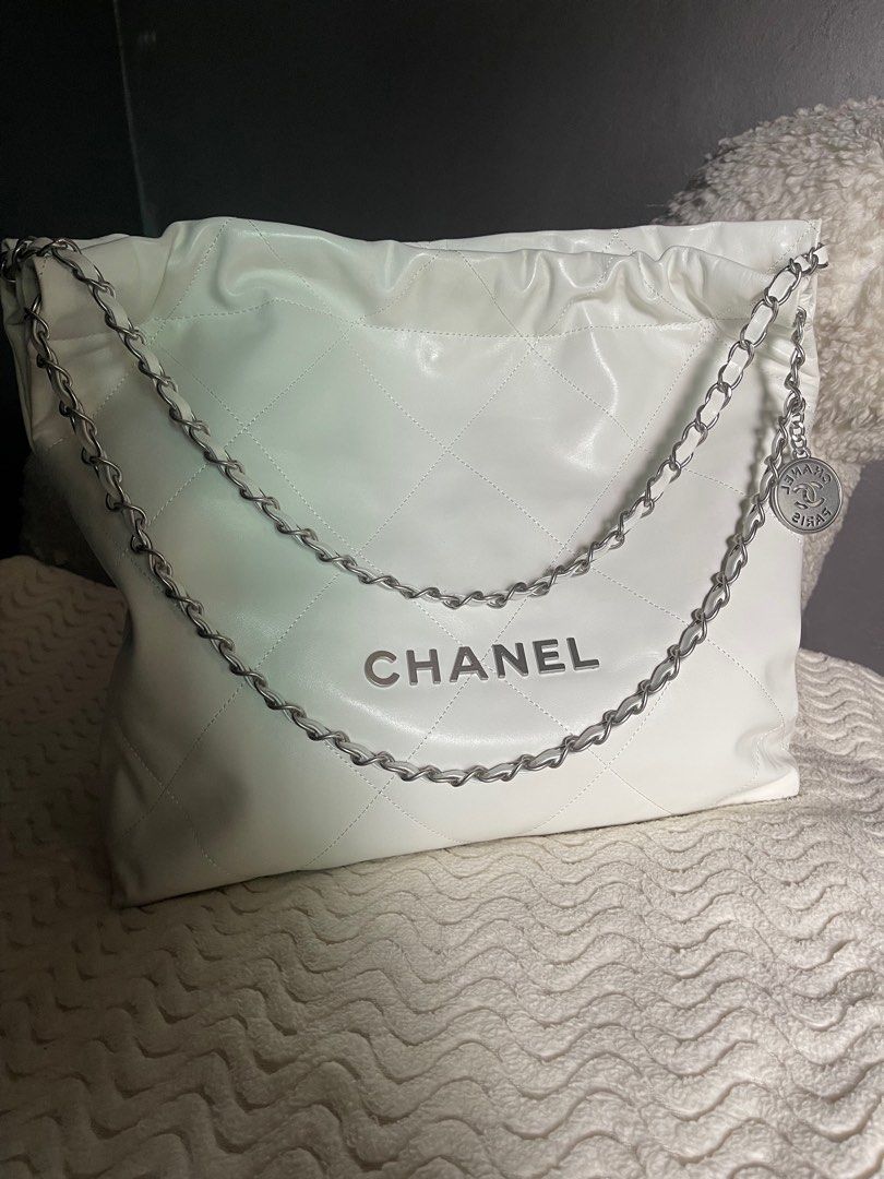 Chanel 22 (Category: Luxury Bags & Wallets) located in Silang. Submitted by girlyouneedthis (Listing ID 1314420976, Image 1). Description: Chanel 22 tote bag shoulder bag, real leather, chanel underzip, micro chip, with pouch, and dustbag. Can fit 12.9 inch Ipad and many more, super minimalist and versatile bag. With minimal flaw that’s why Selling for super low. Last photo is the flaw. No returns, No exchange, No refunds..