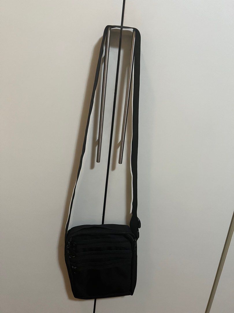 Cross Body Sling Bag (Category: Cross-body Bags) located in Manila. Submitted by project40 (Listing ID 1314507888, Image 2). Description: Black Sling bag Basic material 3 front pockets with zipper 1 big pocket at the back Around 18 cms length, 22 cms height Adjustable straps Hardly used Meet up/pick up is ok (see preferred locations below) Meet up during weekends or evening of weekdays Tropical Hut BF Homes Paranaque Madison Galeries Near Alabang